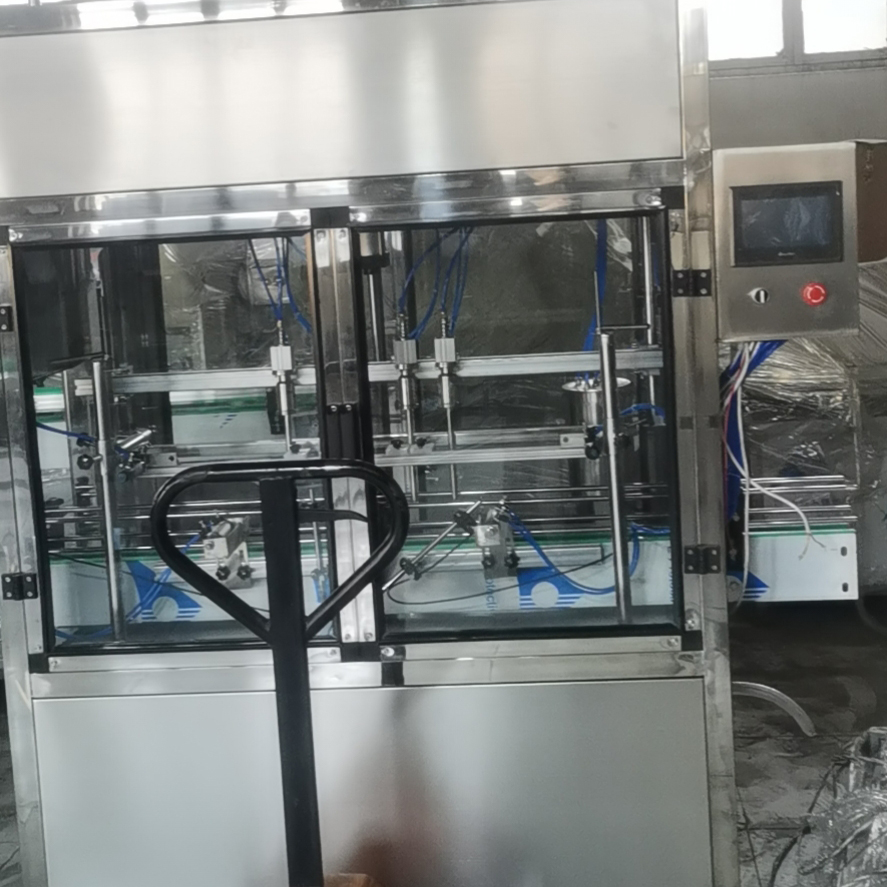 九巧饮料灌装机  四头全自动称重灌装机  适应于多种瓶型，活塞式定量原理