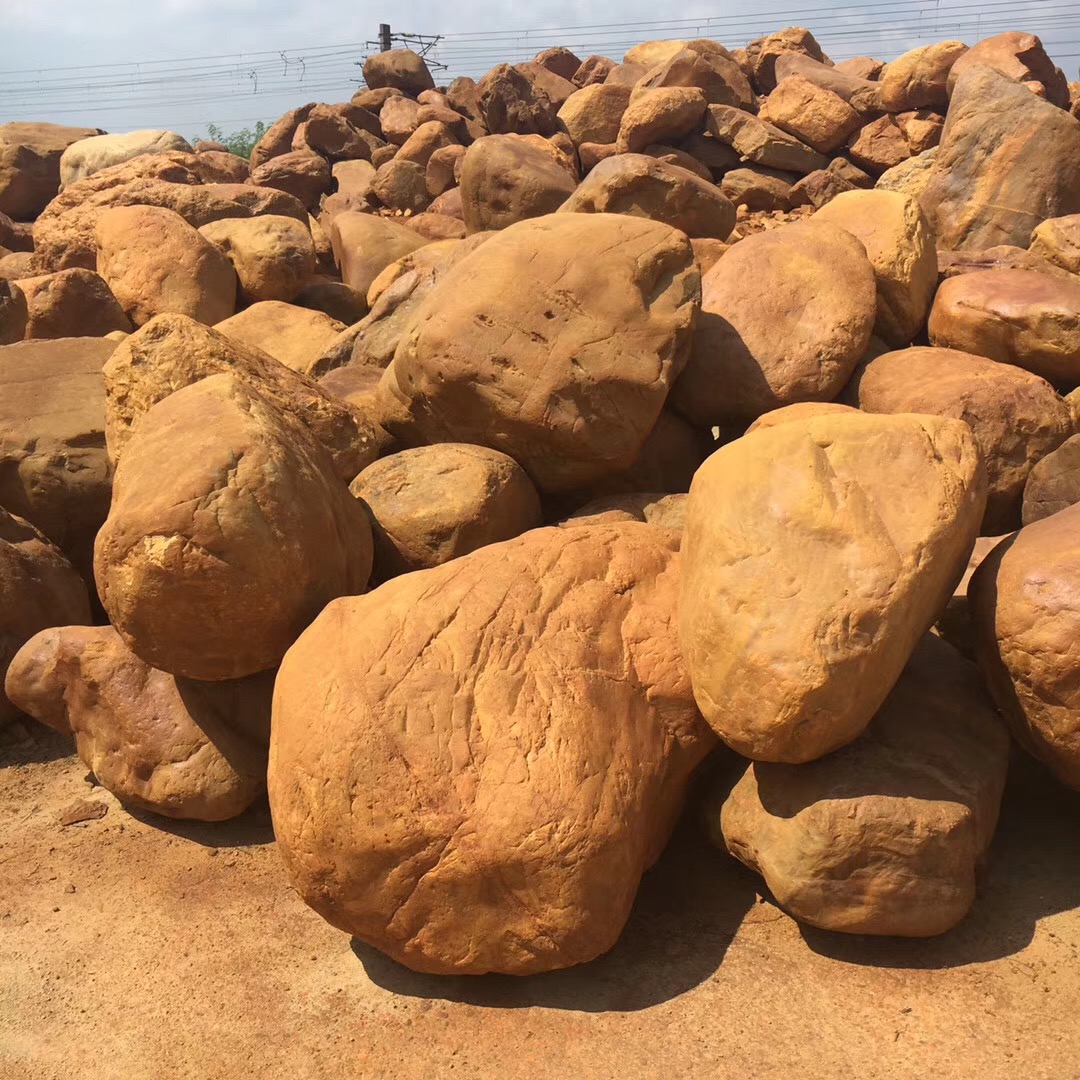 万吨黄蜡石黄石产地批发 蜡黄石 景观石园林石 假山设计施工